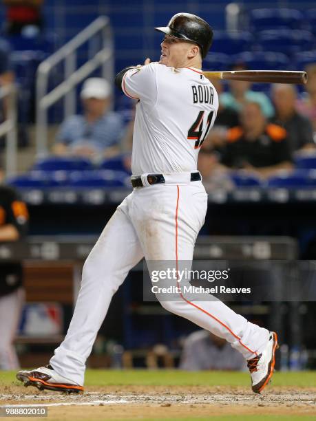 Justin Bour of the Miami Marlins in action against the San Francisco Giants at Marlins Park on June 14, 2018 in Miami, Florida.