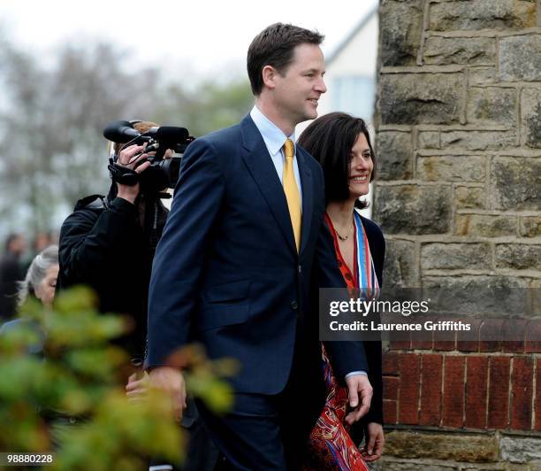 Liberal Democrat Leader Nick Clegg walks through a crowd after casting his vote with wife Miriam Gonzalez Durantez at Bents Green Methodist Church on...