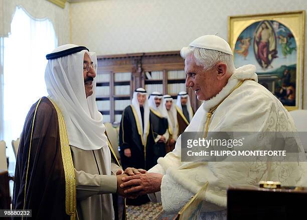 Pope Benedict XVI shakes hands with Kuwait Sheikh Sabah Al Ahmad Al-Jaber Al-Sabah during their meeting on May 6, 2010 at The Vatican. AFP PHOTO /...