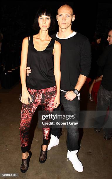 Former swimmer Michael Klim and his wife Lindy attend the front row of the Fernando Frisoni collection show on the fourth day of Rosemount Australian...