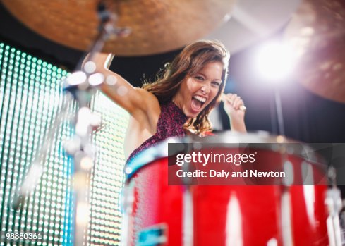 Young woman playing drums Young woman playing drums