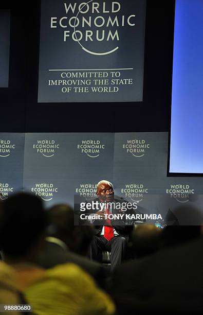 Mozambique's President Armando Emilio Guebuza gestures during a session on investment in Africa on the second day of the World Economic Forum on...