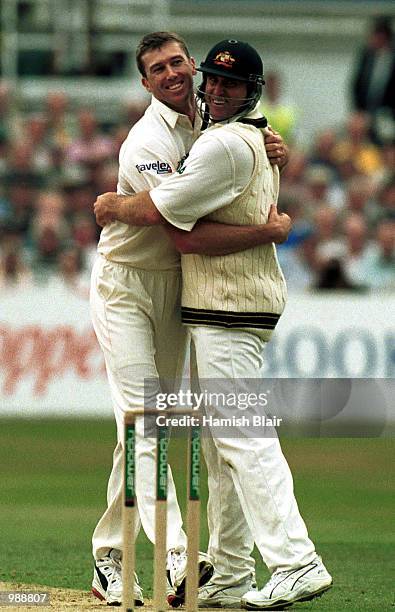 Glenn McGrath of Australia celebrates the wicket of Craig White of England with Matthew Hayden on the first day of the Npower Third Test Match...