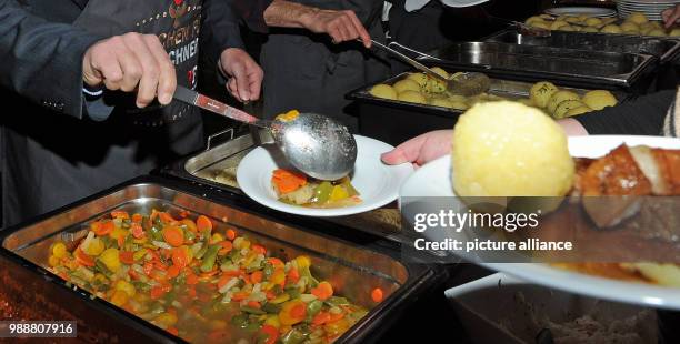 Food being distributed by Munchner Tafel e.V. In the Old Bavarian State Bank in Munich, Germany, 11 December 2017. Munchner Tafel e.V. Aids 22,000...