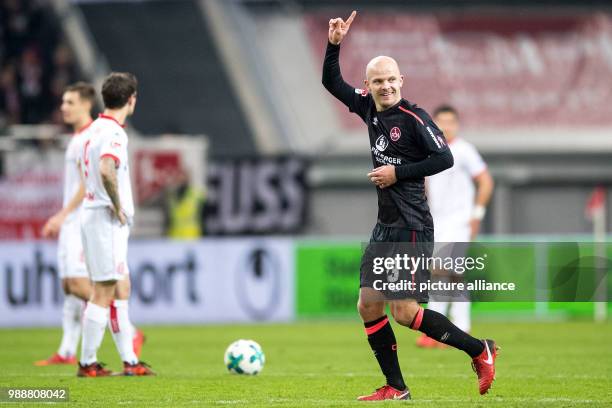 Nuremberg's scorer Tobias Werner cheers over his 1-0 score during the German 2nd Bundesliga soccer match between Fortuna Dusseldorf and 1. FC...