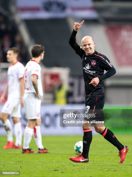 Nuremberg's scorer Tobias Werner cheers over his 1-0 score during the German 2nd Bundesliga soccer match between Fortuna Dusseldorf and 1. FC...