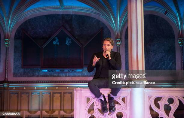 David Jakobs as hunch-backed Quasimodo performs during a press meeting at the Palace Church at the Old Palace in Stuttgart, Germany, 11 December...