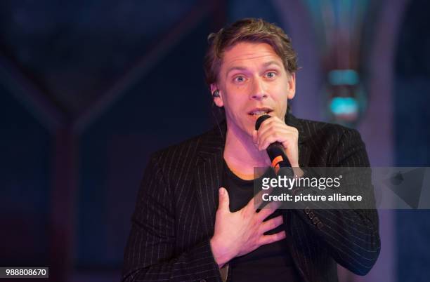David Jakobs as hunch-backed Quasimodo performs during a press meeting at the Palace Church at the Old Palace in Stuttgart, Germany, 11 December...