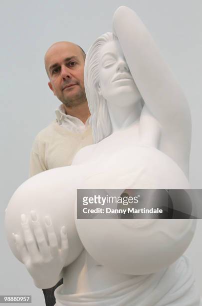 Marc Quinn poses in front of his sculpture 'Chelsea Charms' at photocall for Marc Quinn's new exhibition 'Allanah, Buck, Catman, Chelsea, Michael,...