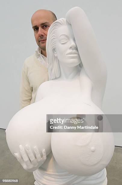 Marc Quinn poses in front of his sculpture 'Chelsea Charms' at photocall for Marc Quinn's new exhibition 'Allanah, Buck, Catman, Chelsea, Michael,...