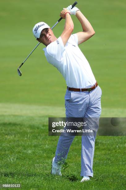 Justin Thomas of The USA plays his second shot on the 1st hole during day four of the HNA Open de France at Le Golf National on July 1, 2018 in...