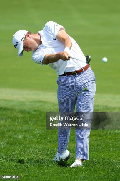 Justin Thomas of The USA plays his second shot on the 1st hole during day four of the HNA Open de France at Le Golf National on July 1, 2018 in...
