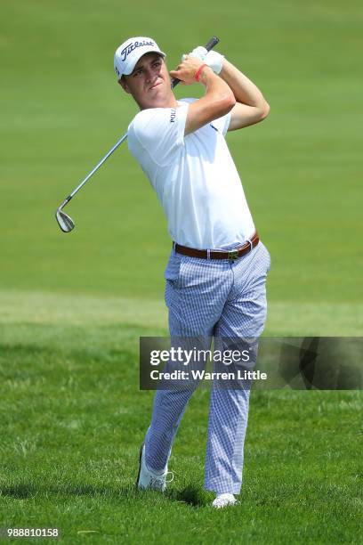 Justin Thomas of The USA plays his second shot on the 1st hole during day four of the HNA Open de France at Le Golf National on July 1, 2018 in...