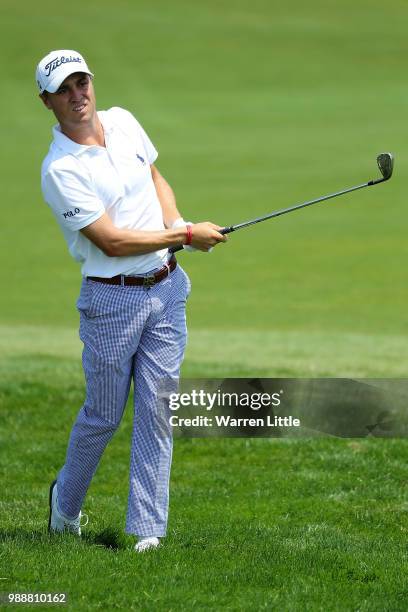 Justin Thomas of The USA plays his second shot on the 1st hole during day four of the HNA Open de France at Le Golf National on July 1, 2018 in...