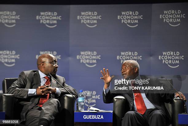 Mozambique's President Armando Emilio Guebuza gestures as he speaks with Africa Development Bank, ADB President, Donald Kaberuka during a session on...