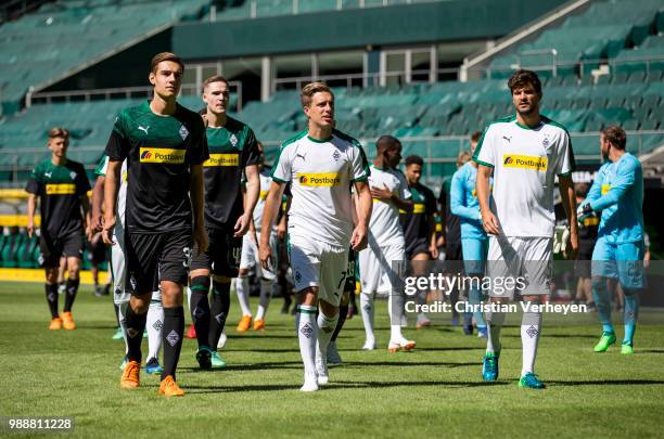 Florian Neuhaus, Patrick Herrmann and Tobias Strobl during a training session of Borussia Moenchengladbach at Borussia-Park on July 01, 2018 in...
