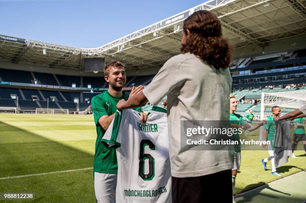 Christoph Kramer get his new jersey during a training session of Borussia Moenchengladbach at Borussia-Park on July 01, 2018 in Moenchengladbach,...