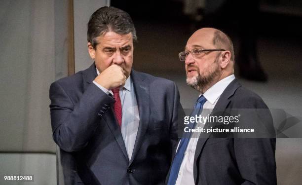 The Chairman of the Social Democratic Party , Martin Schulz, speaks to German Foreign Minister and fellow party member Sigmar Gabriel during a...
