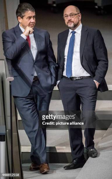 The Chairman of the Social Democratic Party , Martin Schulz, speaks to German Foreign Minister and fellow party member Sigmar Gabriel during a...