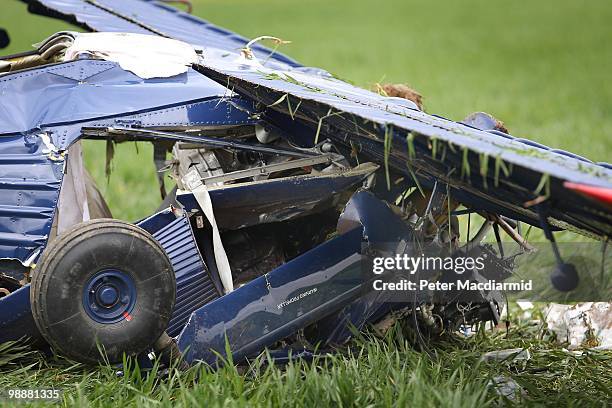 Light aircraft lies in a field at Hinton Airfield after crashing on May 6, 2010 in Brackley, England. The aircraft was carrying United Kingdom...