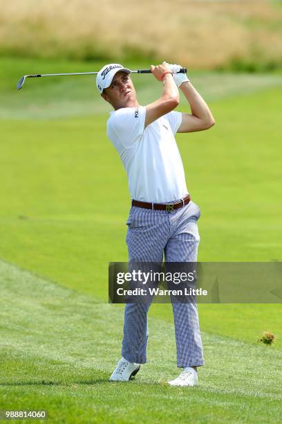 Justin Thomas of The USA plays his second shot on the 6th hole during day four of the HNA Open de France at Le Golf National on July 1, 2018 in...