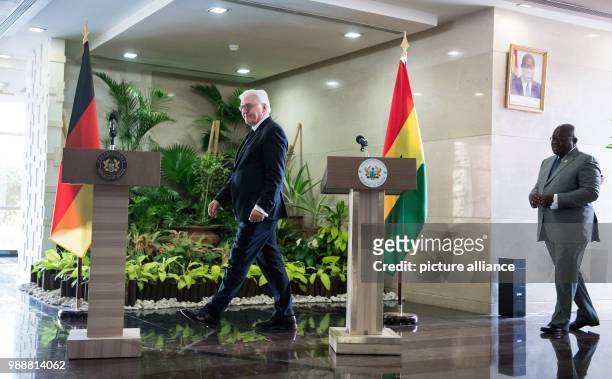 German President Frank-Walter Steinmeier and the president of the Republic of Ghana, Nana Akufo-Addo arrive for a press conference after their...