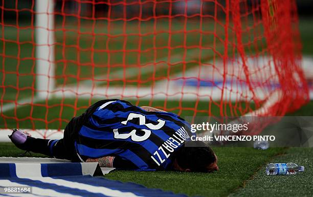 Inter Milan's defender Marco Materazzi lies on the pitch after a tackle by an AS Roma player during their Coppa Italia final on May 5, 2010 at...