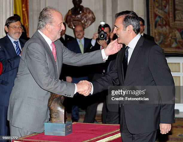 King Juan Carlos of Spain delivers a lifetime achievement award to former golf player Severiano Ballesteros, during the 'National Sports Awards' 2009...