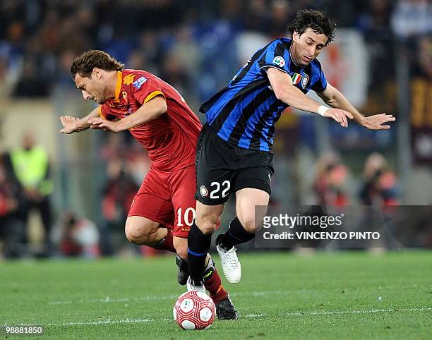 Roma's forward Francesco Totti fights for the ball with Inter Milan's Argentinian forward Alberto Milito Diego during their Coppa Italia final on May...