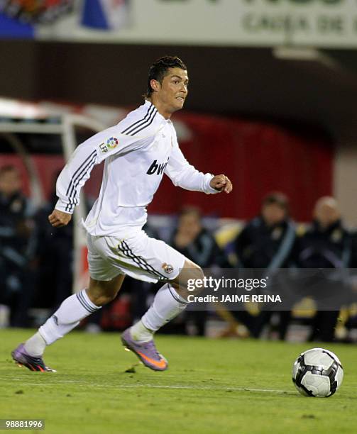 Real Madrid's Portuguese forward Cristiano Ronaldo runs with the ball during the Spanish League football match at the Ono Stadium in Palma de...
