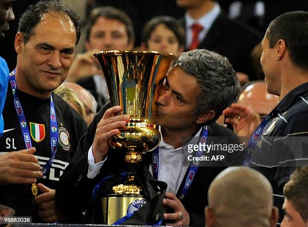 Inter Milan's Portuguese coach Jose Mourinho kisses the Cup after his team defeated AS Roma in the Coppa Italia final on May 5, 2010 at Olimpico...