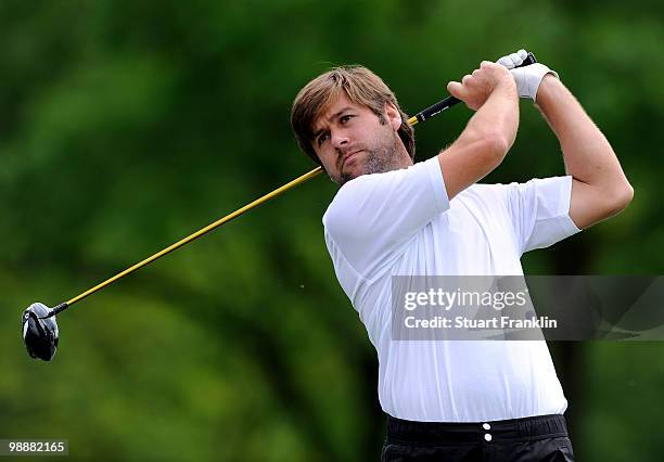 Robert Rock of England plays his tee shot on the 17th hole during the first round of the BMW Italian Open at Royal Park I Roveri on May 6, 2010 in...