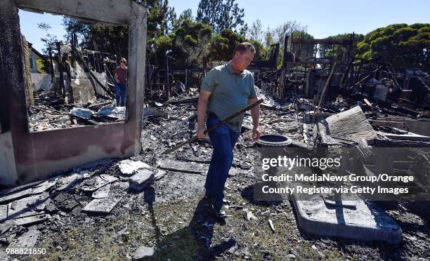 Danny Williamson looks over the remains of his home that was destroyed in the Canyon Fire 2 in Anaheim, California, on Tuesday, October 10, 2017. "n"n