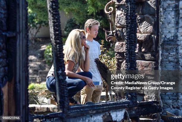 Erin Williamson and her son, Justin Williamson get their first look at their home that was destroyed in Canyon Fire 2 in Anaheim, California, on...
