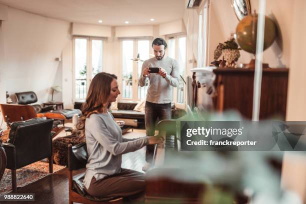 couple playing piano in a lux apartment