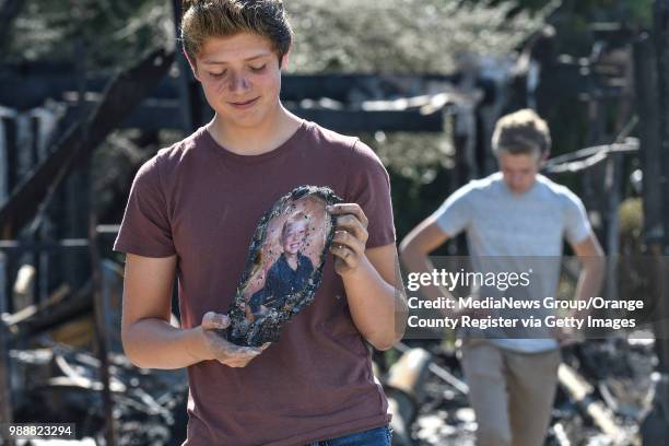 Jordan Williamson exclaimed, "I saved myself" as he found a picture of himself at 5-years old in the rubble of his home that was destroyed in the...