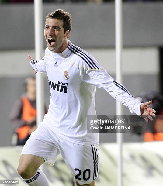 Real Madrid's Argentinian forward Gonzalo Higuain celebrates after scoring against Mallorca during their Spanish League football match at the Ono...
