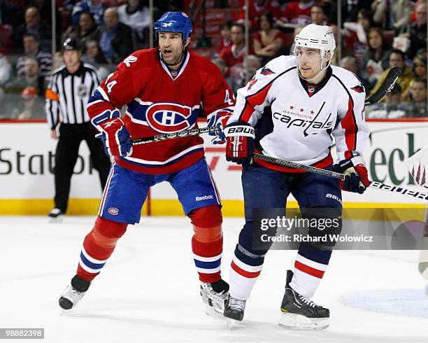 Roman Hamrlik of the Montreal Canadiens defends against Tomas Fleischmann of the Washington Capitals in Game Three of the Eastern Conference...