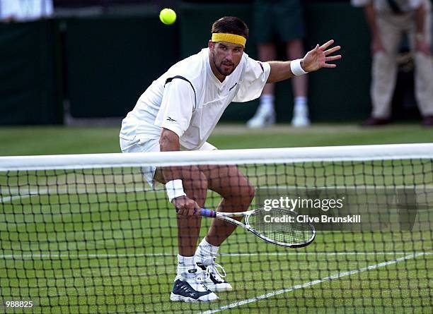 Patrick Rafter of Australia in action against Hicham Arazi of Morroco during the men's third round of The All England Lawn Tennis Championship at...