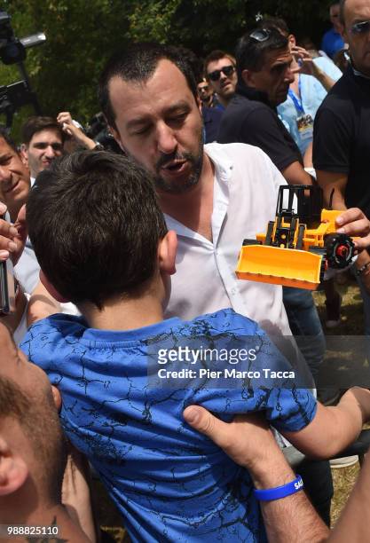 Matteo Salvini, Minister of Interior receives a toy scraper from a child at the end of the Lega Nord Meetinf on July 1, 2018 in Pontida, Bergamo,...