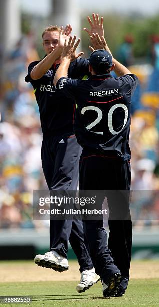 Stuart Broad and Tim Bresnan of England celebrate the wicket of Kamran Akmal during The ICC World Twenty20 Super Eight match between Pakistan and...