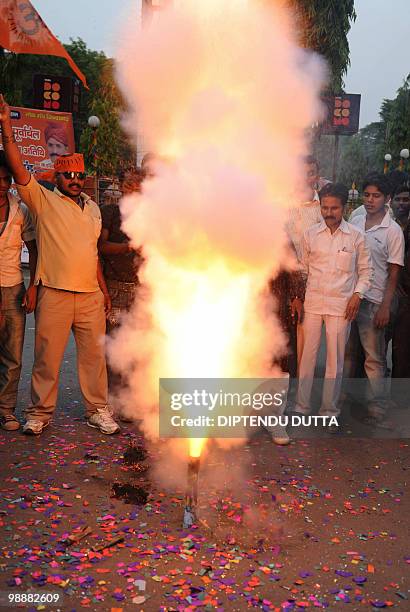 Viswa Hindu Parishad supporters light a flair to celebrate the death sentence of Mohammed Ajmal Amir Kasab in Allahabad on May 6, 2010. The lone...