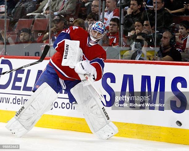 Carey Price of the Montreal Canadiens clears the puck in Game Three of the Eastern Conference Quarterfinals against the Washington Capitals during...