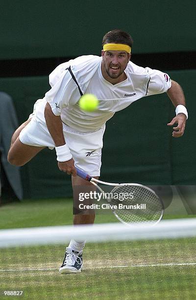 Patrick Rafter of Australia in action against Hicham Arazi of Morroco during the men's third round of The All England Lawn Tennis Championship at...