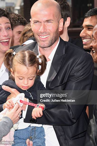 Zinedine Zidane poses with Azylis in his arms during 'Le Prix Ambassadeur Ela' at Musee du Quai Branly on May 6, 2010 in Paris, France.