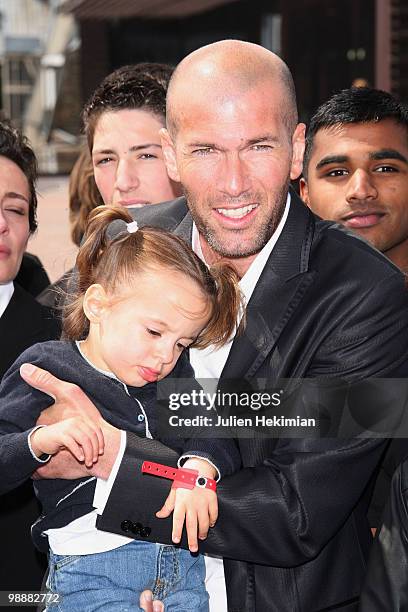 Zinedine Zidane poses with Azylis in his arms during 'Le Prix Ambassadeur Ela' at Musee du Quai Branly on May 6, 2010 in Paris, France.