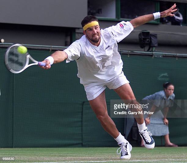 Patrick Rafter of Australia in action against Hicham Arazi of Morroco during the men's third round of The All England Lawn Tennis Championship at...