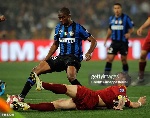 Samuel Eto'o of Inter challenges Daniele De Rossi of Roma during the match the Tim Cup between FC Internazionale Milano and AS Roma at Stadio...