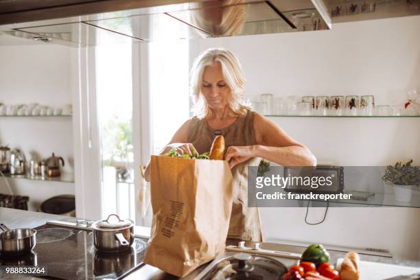 woman unpacking the vegetables