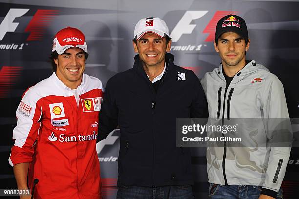 Fernando Alonso of Spain and Ferrari, Pedro de la Rosa of Spain and BMW Sauber and Jaime Alguersuari of Spain and Scuderia Toro Rosso attend the...